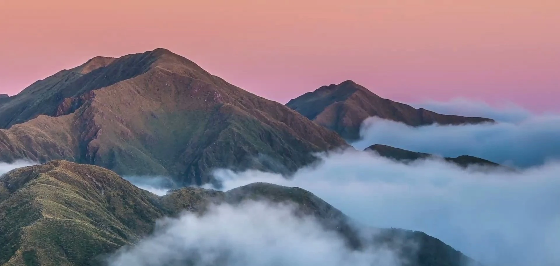 Calming clouds surrounding a peaceful mountain range
